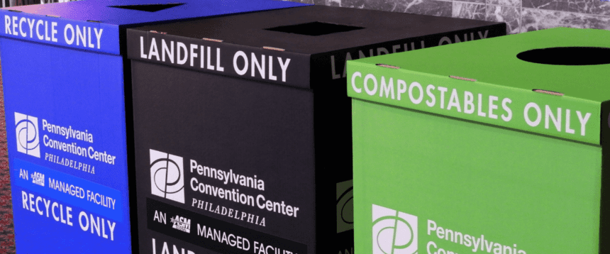 Three cardboard bins are shown. The one on the left is blue and reads RECYCLE ONLY. The one in the middle is black and reads LANDFILL ONLY. The one on the right is green and reads COMPOSTABLES ONLY.