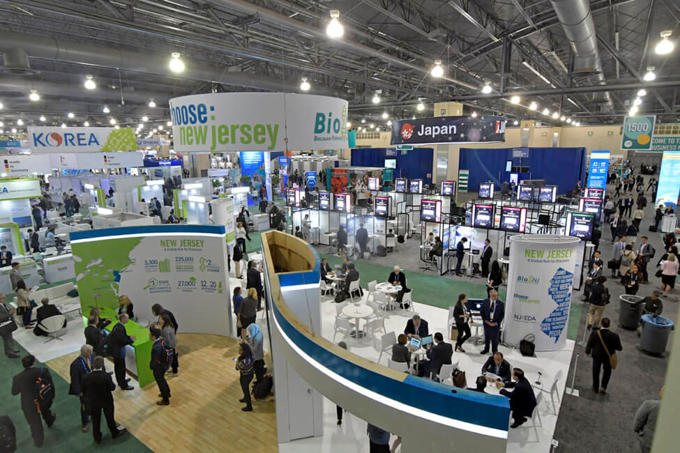 Booths are shown set up inside of the Pennsylvania Convention Center.