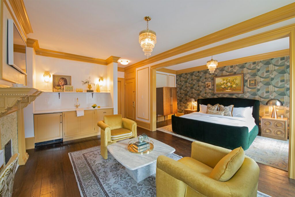 Suite with kitchenette and sitting area at Guild House Hotel