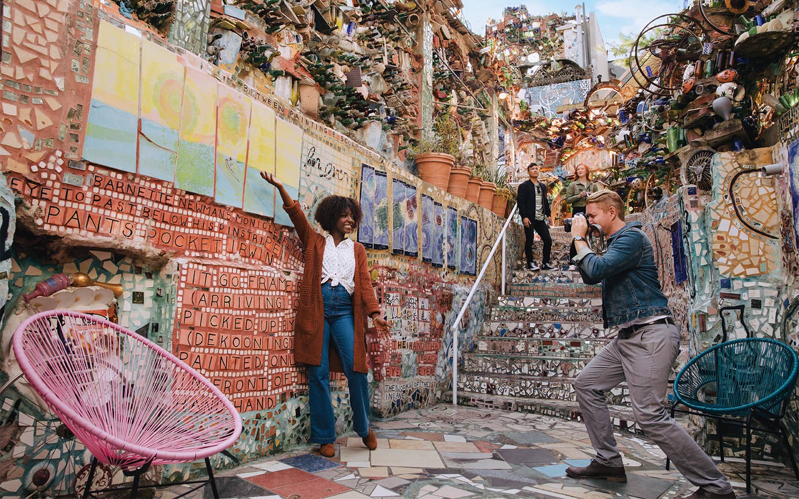 Person taking a photo at Magic Gardens in Philadelphia.