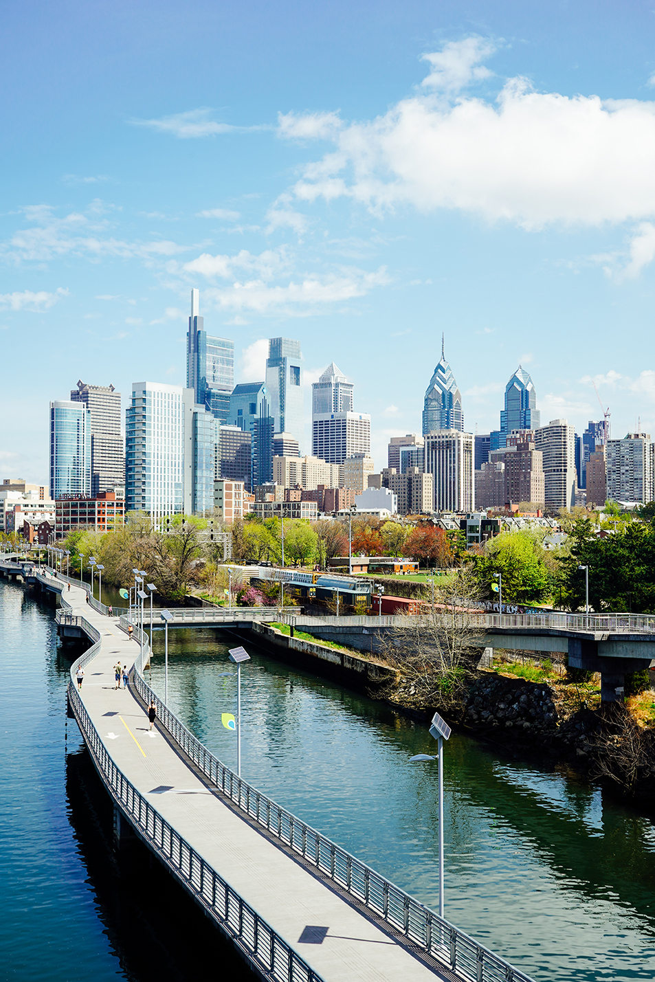 Elevated skyline view of Philadelphia with the Schuylkill river in the foreground and the city in the background
