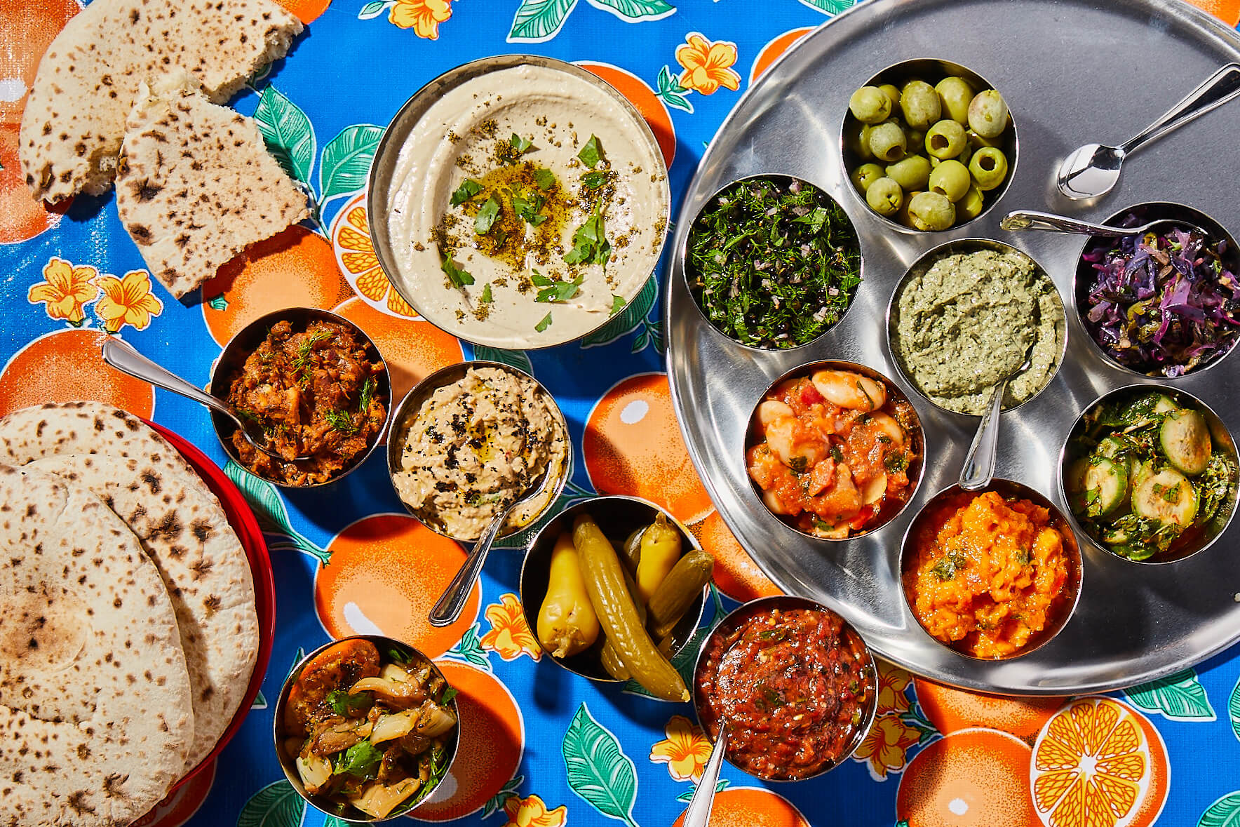 A colorful table cull of mediterranean food.