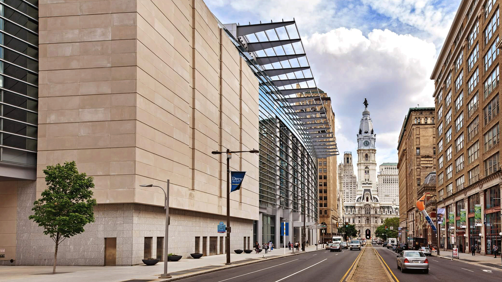 Outside of Pennsylvania Convention Center with City Hall in the background.