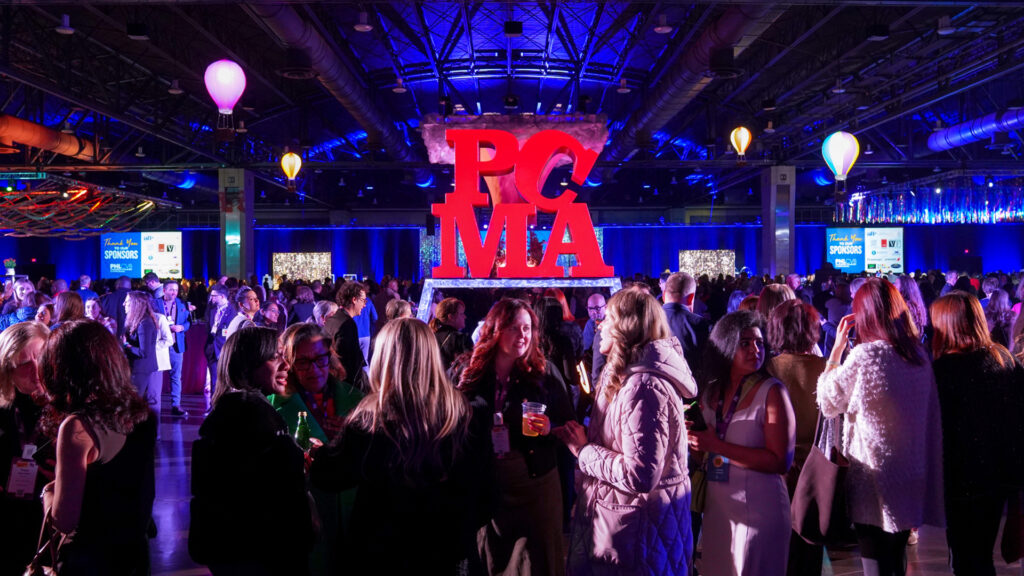 PCMA LOVE statue in the middle of a crowded event