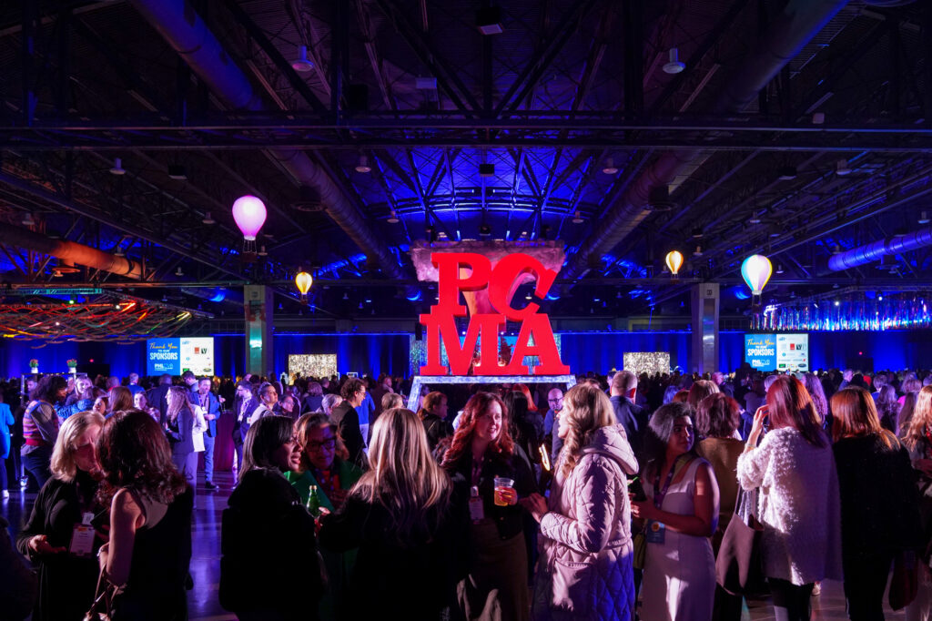 PCMA LOVE statue in the middle of a crowded event