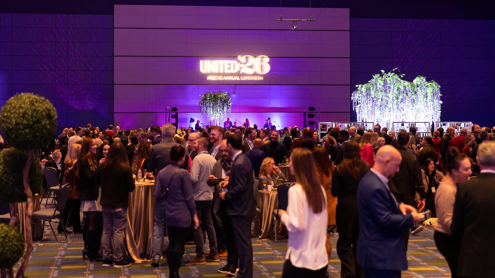 Room full of people at an event.