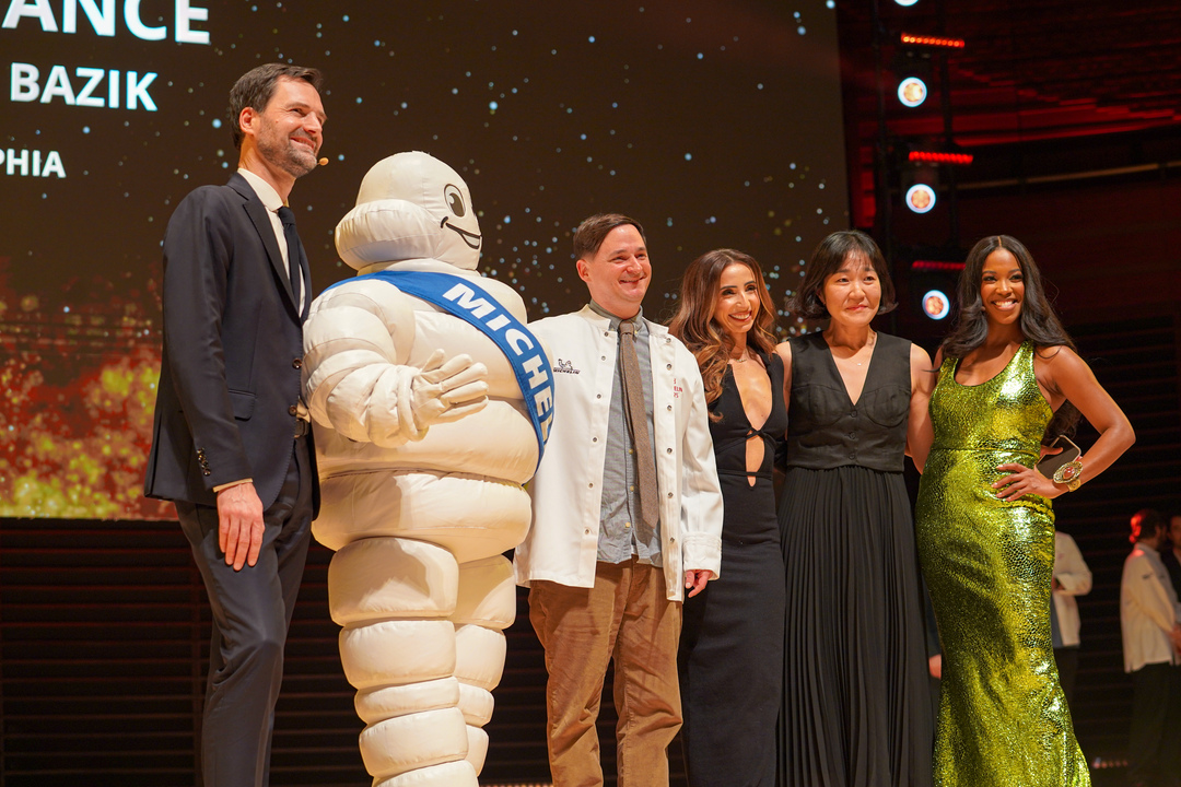 Michelin winner Provenance's head chef and owner poses with the Michelin man.