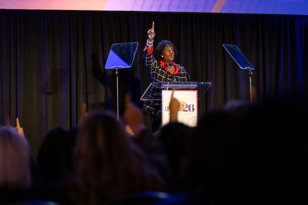 Philadelphia Mayor Cherelle Parker speaks at a podium to a crowded room.