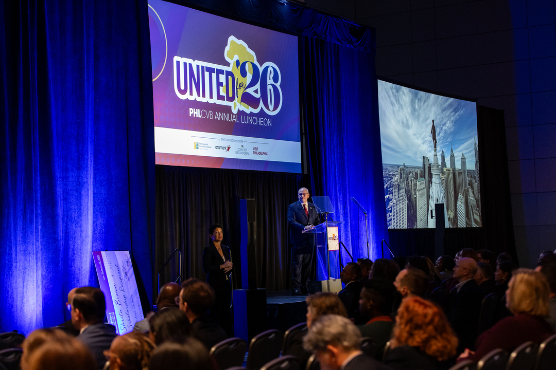 A stage with a sign in the background that reads 