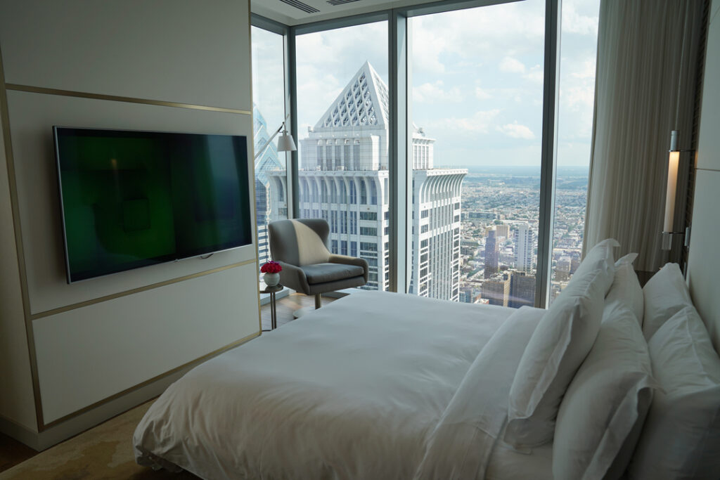 A luxury hotel room looking out on the City of Philadelphia.