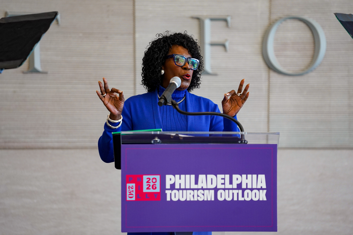 Mayor Parker speaks at a podium during the Philadelphia Tourism Outlook event