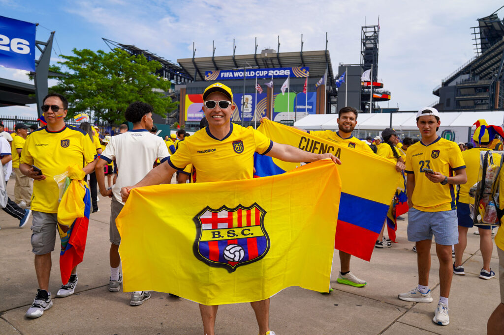A FIFA World Cup Fan hold up his team flag.