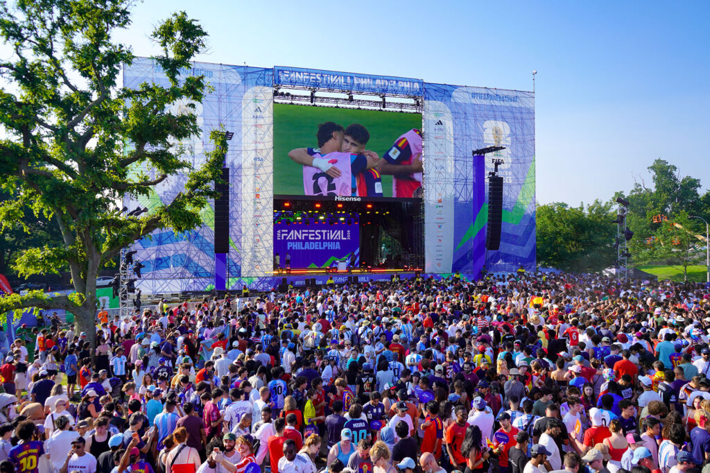 A huge crowd gathers around the giant screen at FIFA Fan Festival