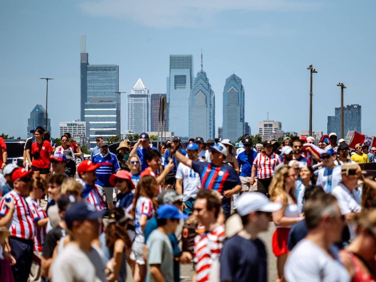 Fans celebrate the World Cup in front of Philadelphia's skyline.