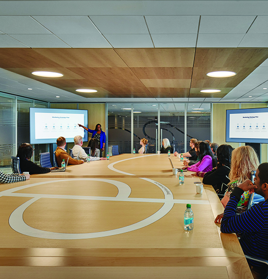 A person points to a presention inside the Executive Board Room at the PA Convention Center