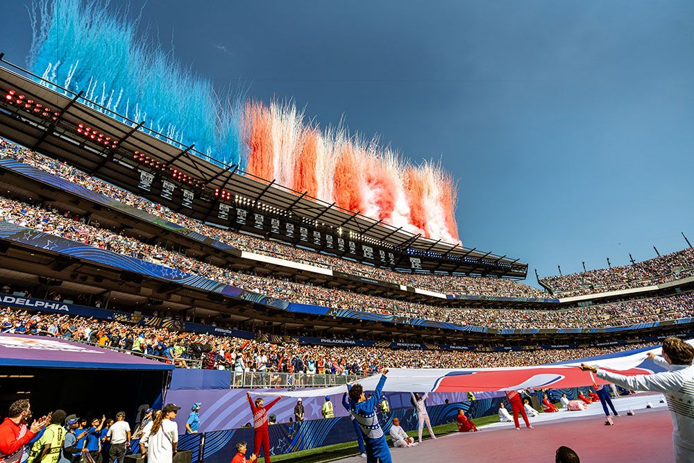 Red White and Blue smoke erupts from Philadelphia Stdium during the World Cup 26.