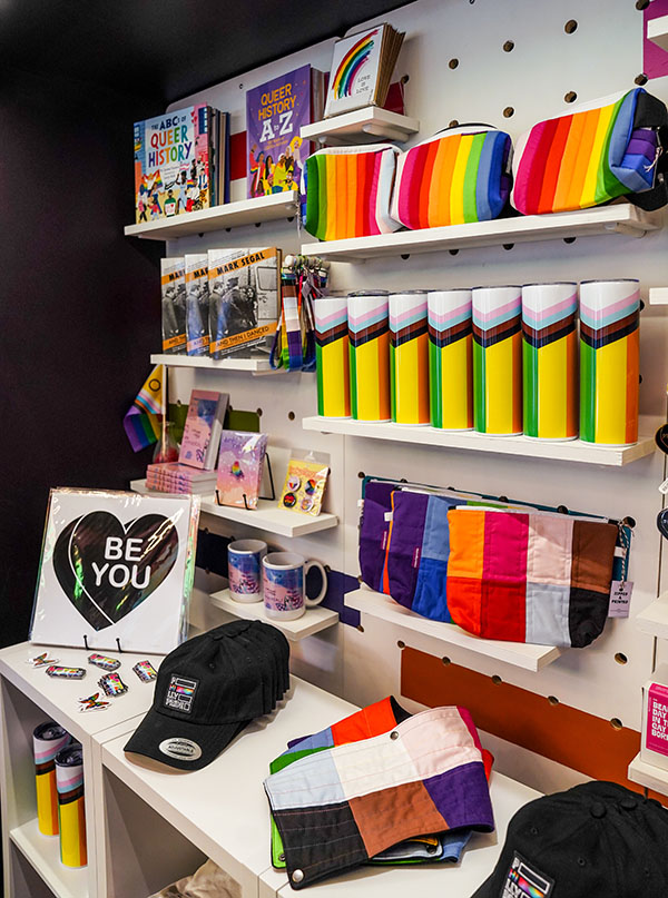 A display shelf of items for purchase at the Philly Pride Visitor Center.