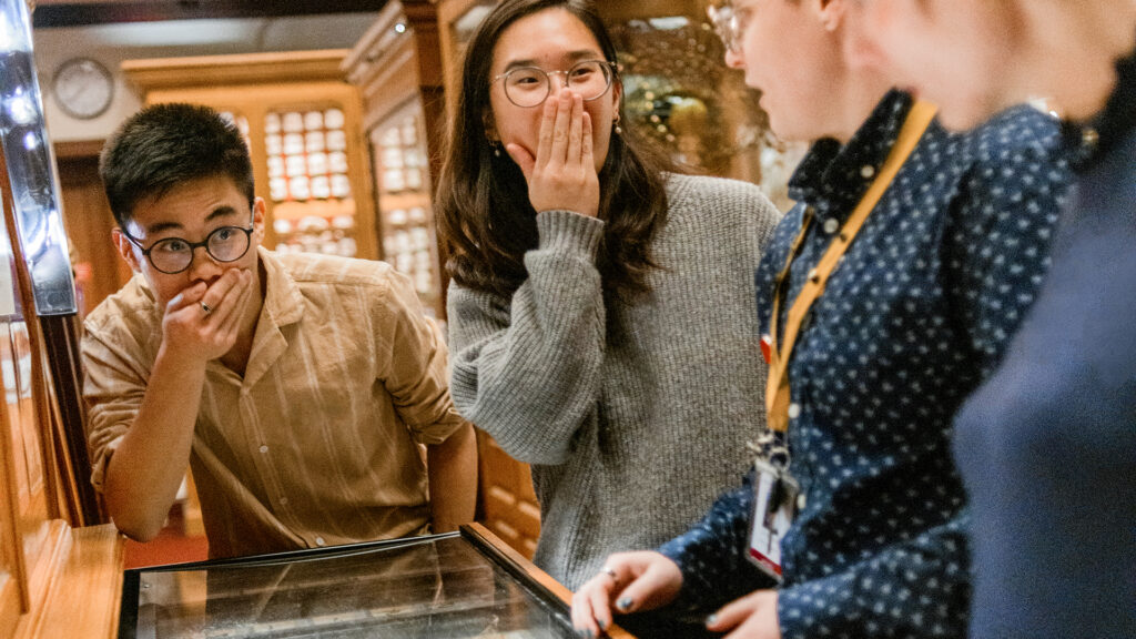 Kids look at each other in shock at an exhibit in the Mutter Museum